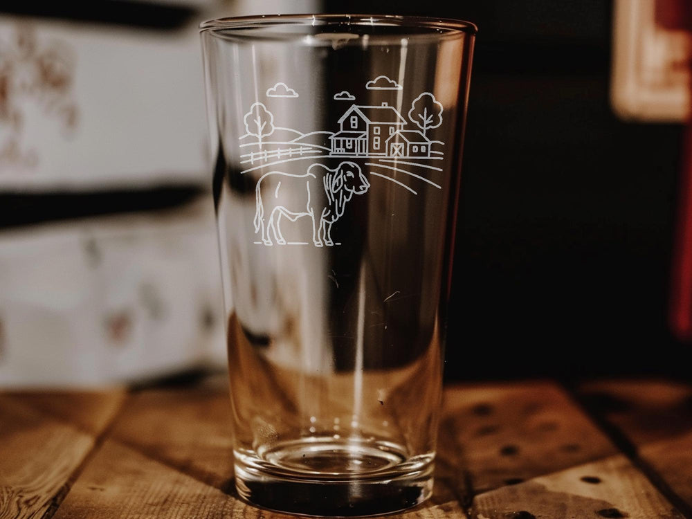 Brahman Cattle Farmhouse Scene Pint Glass – Rustic Ranch Livestock Design – Country Barnyard Decor Drinkware