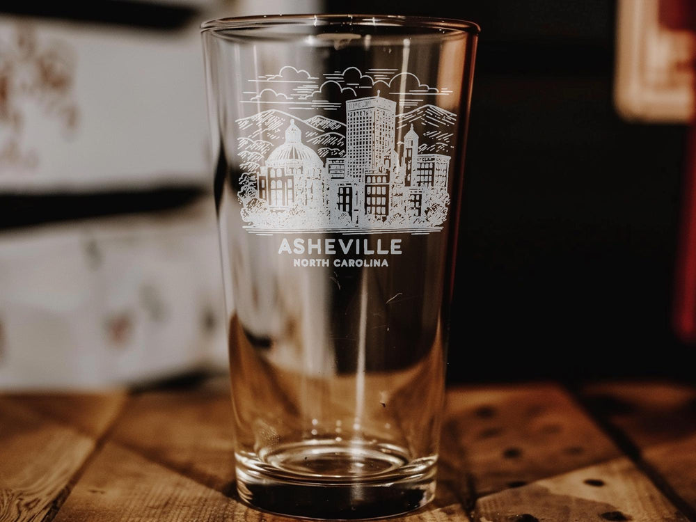 Asheville North Carolina Pint Glass – Blue Ridge Mountains, City Skyline, Landmarks, Outdoor Adventure Theme