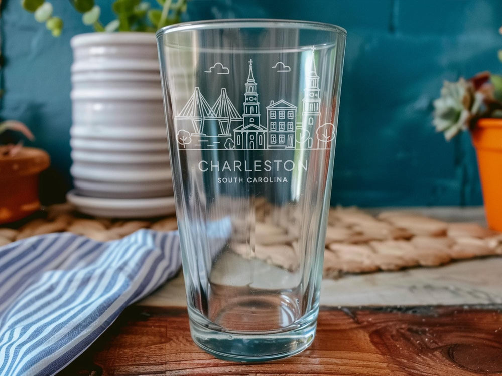 Charleston South Carolina Pint Glass with Historic Landmarks and Coastal Scenery Design