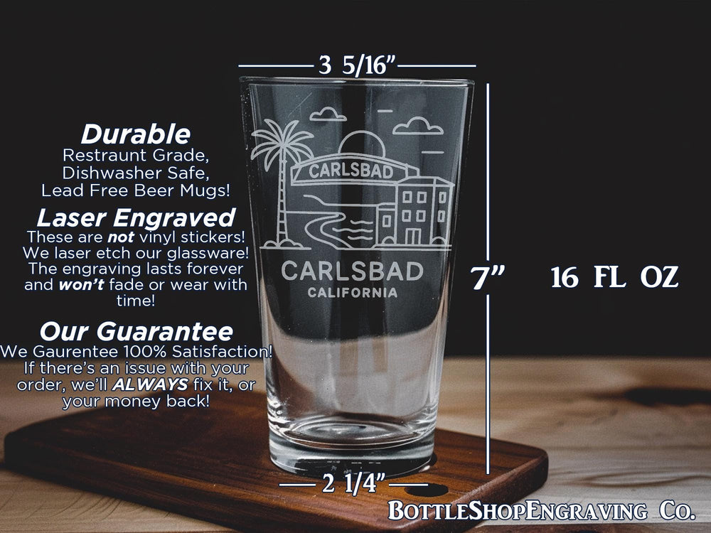 Carlsbad California Pint Glass with Ocean View, Beach Scene, Palm Trees, and Coastal Landmarks Design